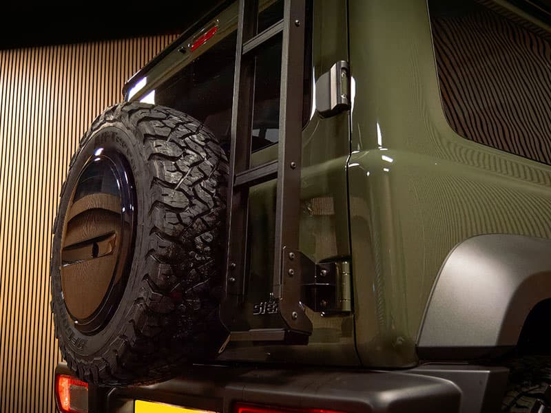 Roof rack with integrated spotlights